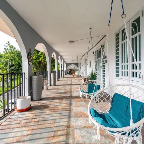 A patio with lush greenery, ideal for relaxing in the fresh air.