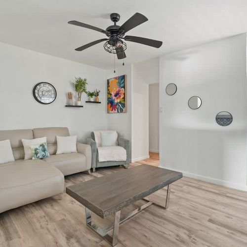 An inviting lounge with stylish furnishings and a sofa.