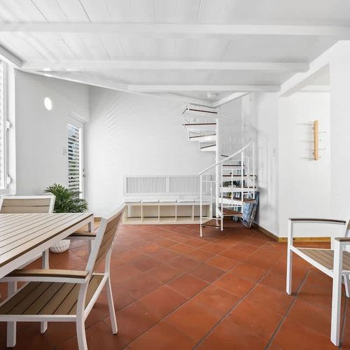 Bright and spacious dining room. This inviting dining area offers ample natural light and a comfortable setting for enjoying meals.