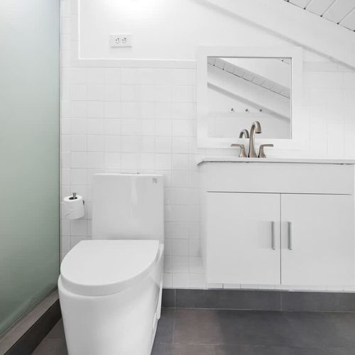 Sparkling Clean Bathroom with Remarkable Vanity. Step into a refreshing oasis with this pristine white bathroom.