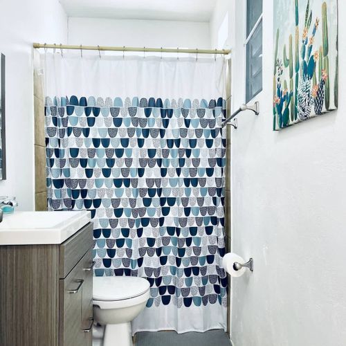 Freshen up in our sparkling clean bathroom, fully equipped with a refreshing shower, premium conditioner, body wash, and all the essentials for your convenience.