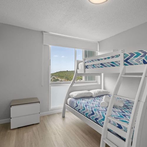 More adventures, more comfort! This bright room features another set of cozy bunk beds, offering flexible sleeping arrangements and fun for families or groups.