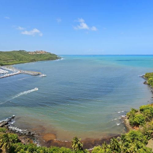 Discover breathtaking coastal beauty! This stunning aerial view showcases the mesmerizing turquoise waters of the bay, highlighting the serene marine environment right at your doorstep.