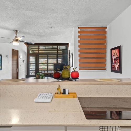 Our kitchen extends into a functional space featuring a coffee maker and a blender, ready for your morning smoothie or evening cocktail preparations