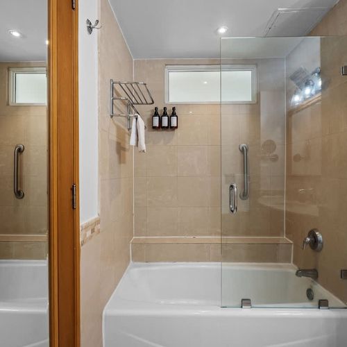 Enjoy hotel-quality amenities in your private en-suite bathroom, complete with a well-lit vanity and ample counter space