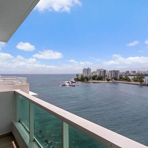 Your private sanctuary: step out onto the balcony and be mesmerized by the panoramic views of Condado Lagoon and the city skyline.