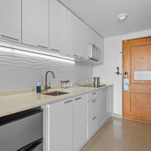 Whip up delicious meals in your fully equipped modern kitchenette, complete with a microwave, refrigerator, and stovetop
