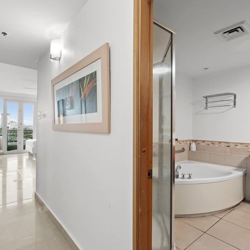 Enjoy the convenience and elegance of our well-maintained bathroom. The semi-frameless shower provides a spacious feel, while the overall design ensures a clean and comfortable environment for your personal care