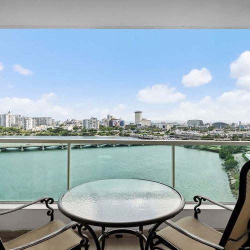 Step out onto your expansive private balcony and be captivated by the sweeping views of the Condado Lagoon and the San Juan skyline. This is your perfect spot for morning coffee or evening cocktails with a view.