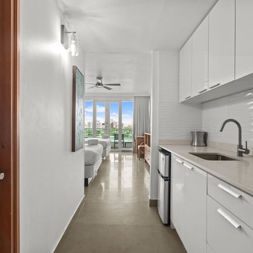 Thoughtfully designed for efficiency and style, our modern kitchenette provides everything you need to enjoy a quick snack or a full breakfast before heading out to explore. The built-in microwave and clean counters make meal prep a breeze.