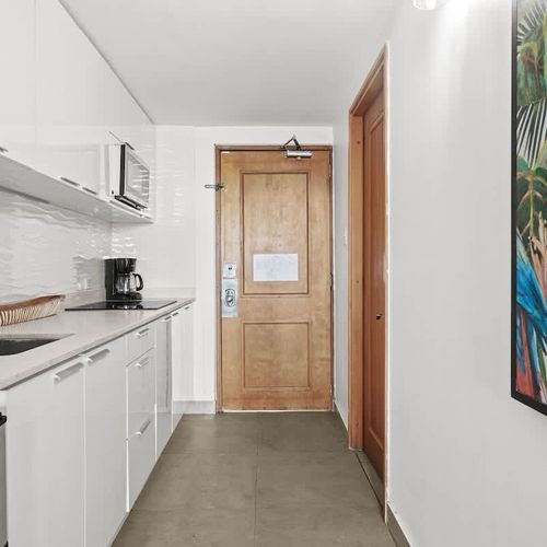 Enter a bright and welcoming space, where modern design meets practicality. Our sleek kitchenette, complete with essential appliances, is immediately accessible, making arrivals smooth and your stay effortlessly comfortable.