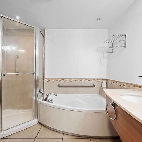 Step into our modern, glass-enclosed shower, designed for a refreshing and comfortable experience. With ample space and clean lines, it's the perfect spot to wash away the day and feel revitalized