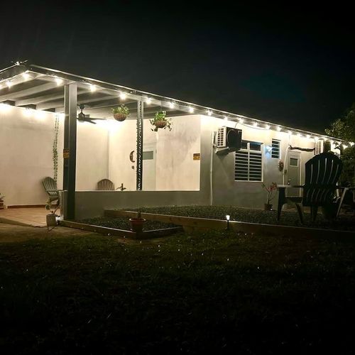 Cozy countryside escape lit up at night—enjoy quiet conversations under the string lights or stargaze from the Adirondack chairs. Your peaceful stay at Casa Natura begins here.