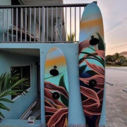 While you can't take these surf boards for a ride, they double as your outdoor showers!