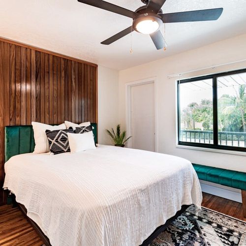 No less thoughtfully put together, the queen bedroom offers bright views and cozy comfort