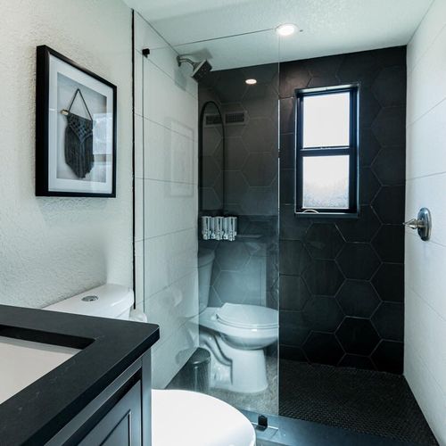 This bright and sleek bathroom offers a large, walk-in shower to refresh after a good night's sleep. If you're coming from the beach there's an outdoor shower to wash off the sand!