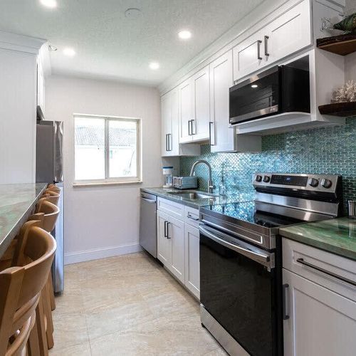 With brand new appliances and emerald countertops, could you be anywhere else but a dreamy condo on Florida's Atlantic coast?