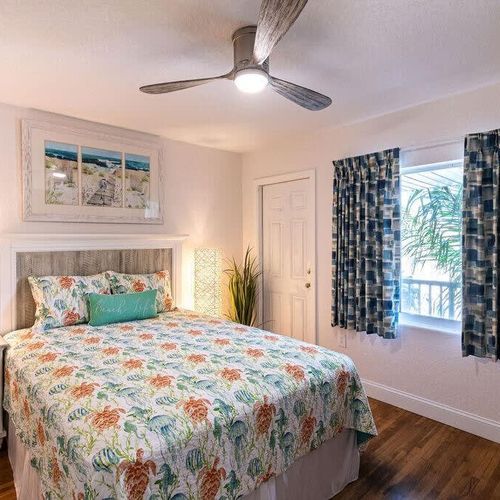 No less thoughtfully put together, the queen bedroom offers bright views and cozy comfort.