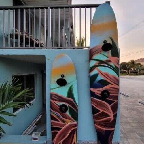 You may not have noticed it in the first photo – while you can't take these surf boards for a ride, they double as your outdoor showers.