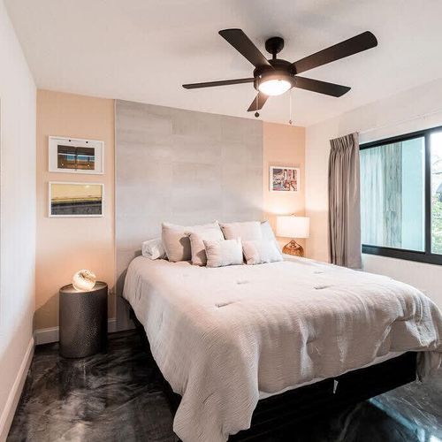 Next, the queen bedroom ain't nothing to scoff at! Its modern decor provides the right ambiance while the roomy window lets the Florida sun in – unless you use the room darkening drapes.