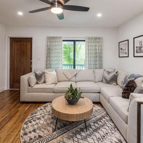 The living room is meant to help you relax and get out of the sun, complete with ceiling fan, extended sectional and Smart TV.