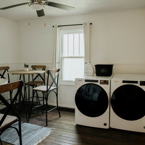 Take a seat and relax while you do your laundry in this comfortable laundry area.