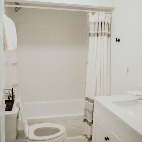 Experience our elegant, clean bathroom fully equipped with towels and essential bathroom amenities.