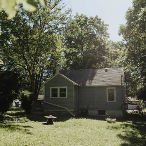 Here's the backyard of the property, an expansive open space perfect for strolling, breathing, and relaxing.