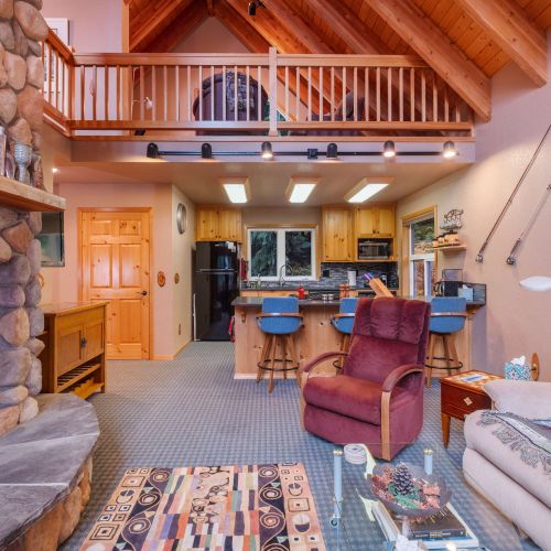 With a firepit as the centerpiece, this living room offers a warm, inviting space for relaxation and conversation.