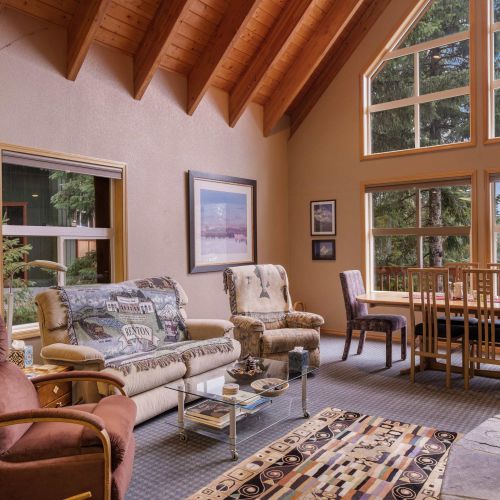 A beautifully furnished living room with cozy seating and plenty of natural light, making it the perfect spot to unwind.