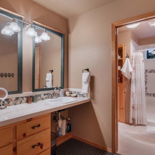 A wood-inspired vanity sink with sleek, contemporary fixtures brings a warm, inviting touch to your bathroom.