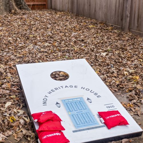 Fun and branded: custom corn hole boards featuring the house logo, perfect for a lively game and adding a personal touch to your stay.