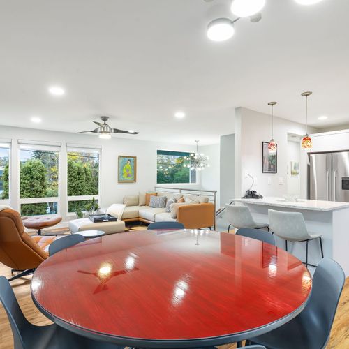 This bright dining area features a great seat that blends comfort with style, perfect for leisurely meals or family dinners.