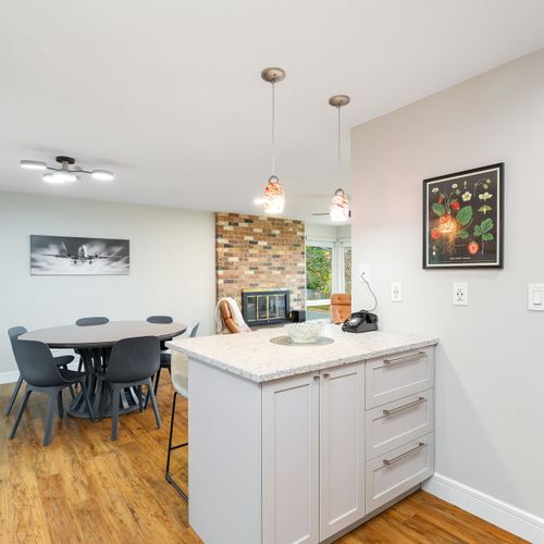 This bright dining area features a great seat that blends comfort with style, perfect for leisurely meals or family dinners.