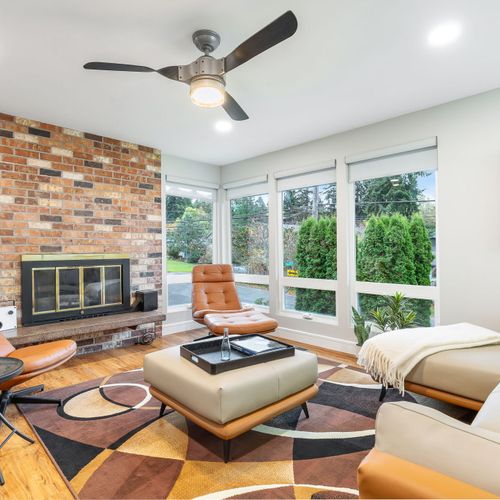 This living room features a gorgeous fireplace, providing both visual appeal and warmth.