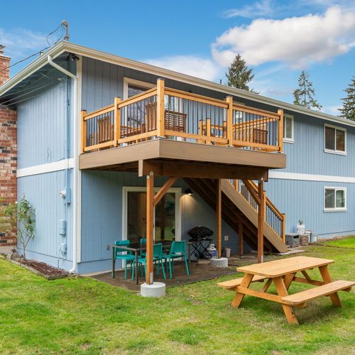 Enjoy wide-open spaces with a large yard in front, on the sides, and out back, complete with an upstairs deck for added outdoor living.