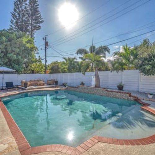 Savor the Fort Lauderdale sunshine as you unwind in this charming private pool, safely enclosed by a fence to protect your privacy.