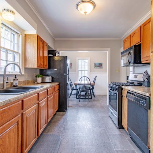 A fully equipped kitchen featuring modern countertops and appliances, perfect for cooking and baking. Ample cookware, utensils, and supplies ensure you’ll have everything you need, plus child-friendly dining ware to make mealtime easy for everyone!