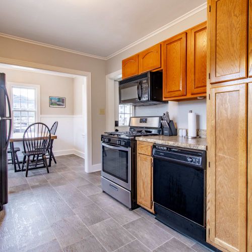 A fully equipped kitchen featuring modern countertops and appliances, perfect for cooking and baking. Ample cookware, utensils, and supplies ensure you’ll have everything you need, plus child-friendly dining ware to make mealtime easy for everyone!