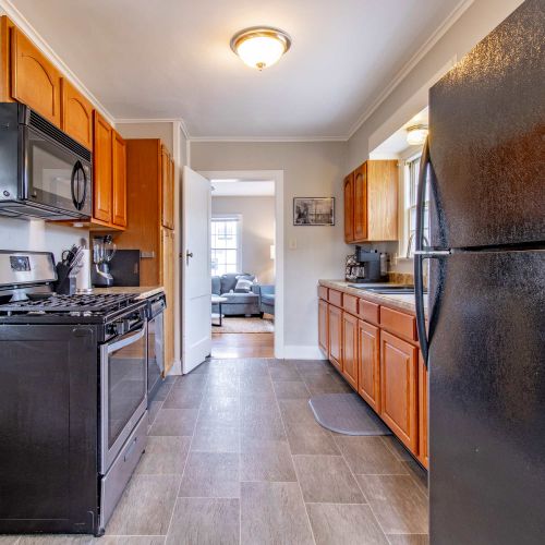 A fully equipped kitchen featuring modern countertops and appliances, perfect for cooking and baking. Ample cookware, utensils, and supplies ensure you’ll have everything you need, plus child-friendly dining ware to make mealtime easy for everyone!