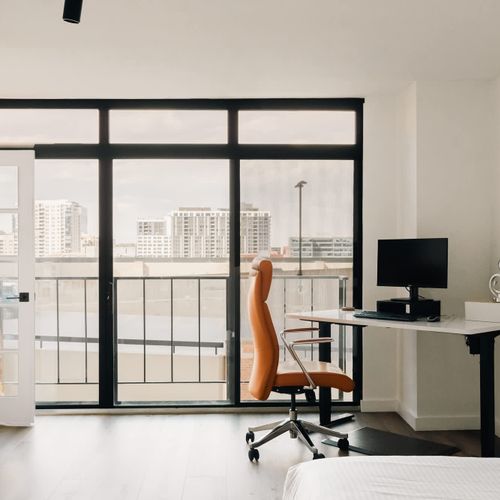 Desk, chair, and monitor available for guest use