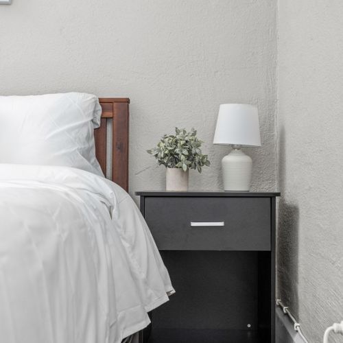 Nightstands with ample storage space and a lamp for your convenience.