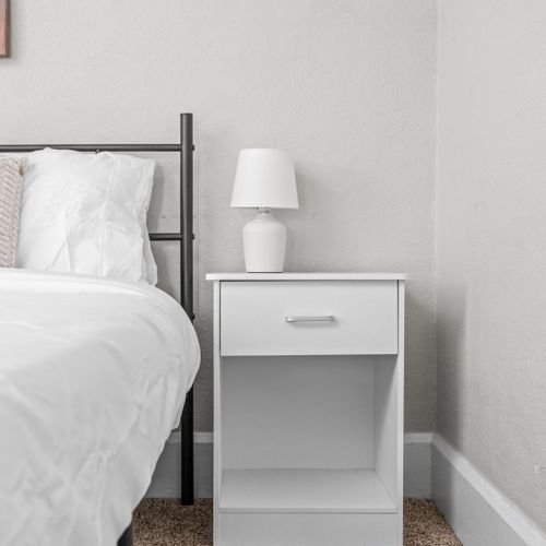 Nightstands with ample storage space and a lamp for your convenience.