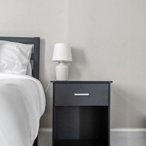 Nightstands with ample storage space and a lamp for your convenience.