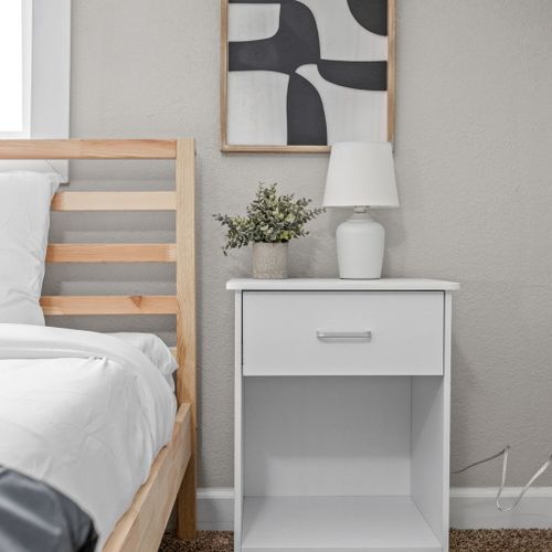 Nightstands with ample storage space and a lamp for your convenience.