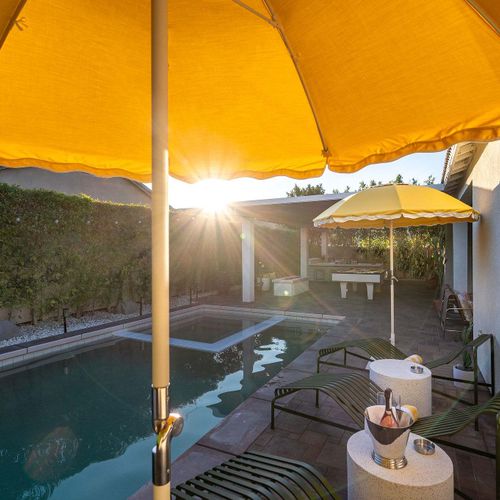 Pool and hot tub at sunset