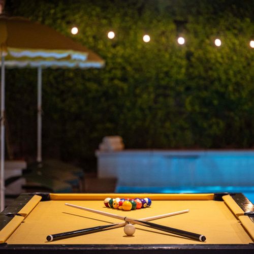 Billiards table overlooking the pool at night