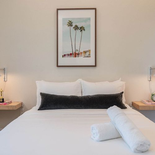 Bedroom 6 with queen bed (Please note: Bedroom 6 is a garage-to-bedroom conversion with a full bathroom. This bedroom has a separate entrance attached to the home and is only accessible from the exterior)