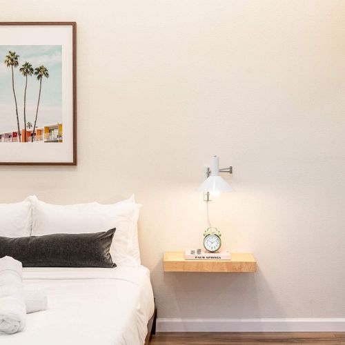 Bedroom 6 with queen bed (Please note: Bedroom 6 is a garage-to-bedroom conversion with a full bathroom. This bedroom has a separate entrance attached to the home and is only accessible from the exterior)