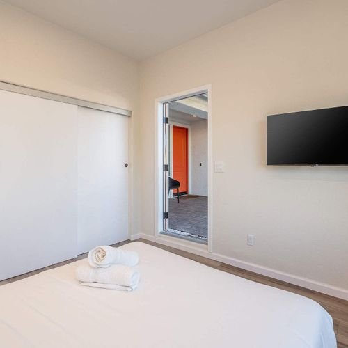 Bedroom 6 patio exit (Please note: Bedroom 6 is a garage-to-bedroom conversion with a full bathroom. This bedroom has a separate entrance attached to the home and is only accessible from the exterior)